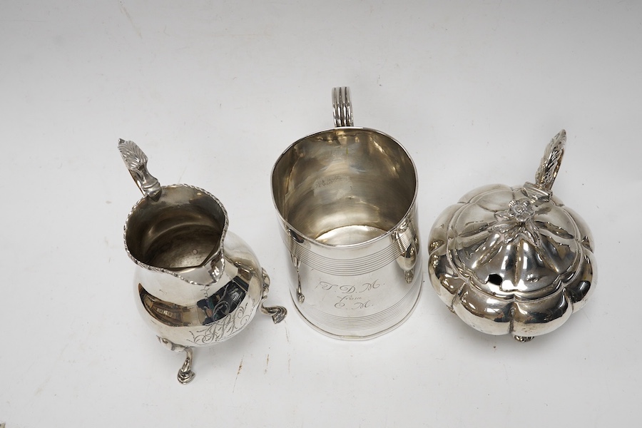 A George III silver cream jug, marks rubbed, a George III silver christening mug, London, 1801 and a William IV silver melon shaped mustard pot, John, Henry & Charles Lias, London, 1835. Condition - poor to fair